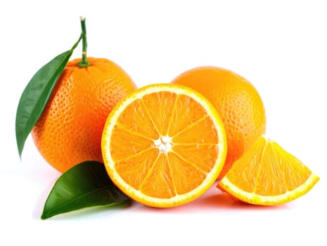 Juicy oranges displayed with green leaves, showcasing their vibrant color and texture. Perfect for a nutritious snack or addition to recipes, enhancing flavor and vitamin intake.