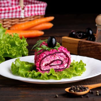A colorful roll of beetroot and cream cheese is artfully presented on a white plate, surrounded by fresh lettuce. Black olives and herbs add a vibrant touch, creating an appetizing display.