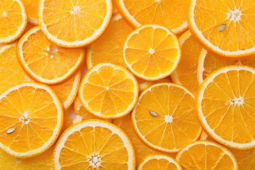 Bright orange slices are arranged closely, showcasing their juicy segments and textures. The vivid colors highlight freshness, ideal for recipes, snacks, or drinks.