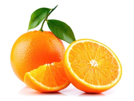 Juicy oranges are presented with one whole fruit and two slices. The vibrant orange color and textured surface highlight the freshness and appeal of this citrus fruit, perfect for healthy snacks.