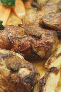 Succulent roasted chicken pieces served with tender vegetables and rich sauce.