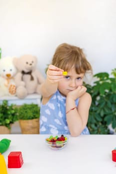 Child with jelly candies. Selective focus. kid.