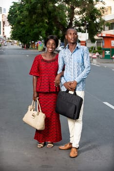 middle aged man and woman talking business portrait and standing outside with trees in the background