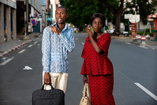 adult business people discussing doing each one an outdoor gesture in the street smiling
