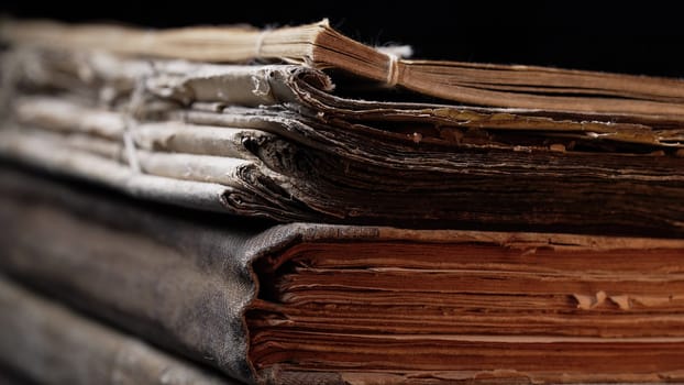 Close-up macro view of old book spines, revealing cracked leather, worn pages. Rich textures, faded bindings capture. History, antique literature. Nostalgia, knowledge, time concept. High quality
