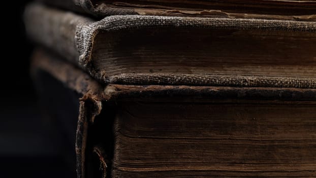 Close-up macro view of old book spines, revealing cracked leather, worn pages. Rich textures, faded bindings capture. History, antique literature. Nostalgia, knowledge, time concept. High quality