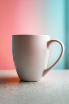 White ceramic mug on a textured countertop with soft blue and pink pastel lighting. Perfect for branding mockups, minimalist product scenes, and cozy beverage-related visuals