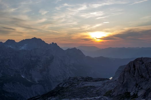 Sunset - Panorama of massive Alpine mountains. Landscape in the Austrian Alps of the Dachstein region (Styria in Austria)
