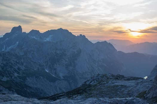 Sunset - Panorama of massive Alpine mountains. Landscape in the Austrian Alps of the Dachstein region (Styria in Austria)
