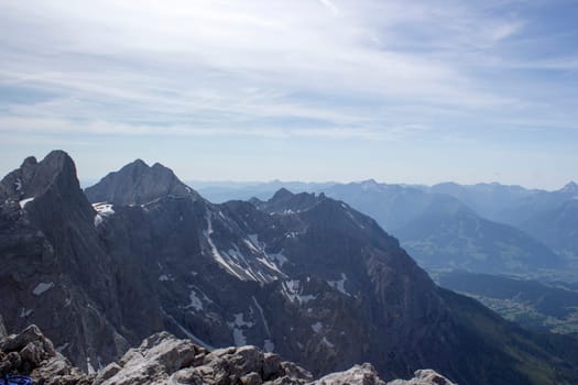Panorama of massive Alpine mountains. Landscape in the Austrian Alps of the Dachstein region (Styria in Austria) - view from Dachstein