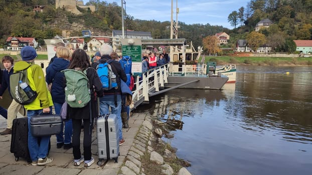 October 17 2024 Hrensko Czech Republic Europe - People boarding ferry editorial photo landscape scene crowd summer day park shotlisttravel autumn trees travel tourism transport tourist water park nature . High quality photo