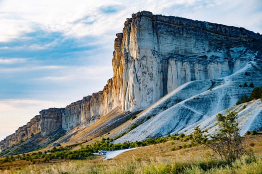 Scenic landscape showcasing the majestic White Rock mountain in Koktebel, Crimea, during a vibrant sunset