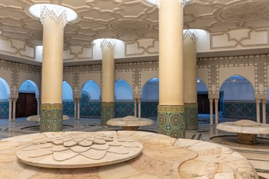 Closeup view of  pillars and stone seats at Mosque Hassan II, Casablanca, Morocco. Horizontal.