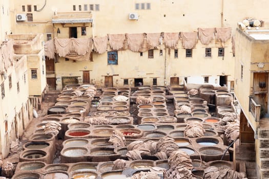 High angle view of Chouwara Leather traditional tannery in ancient medina of Fes El Bali, Morocco. Horizontally. 