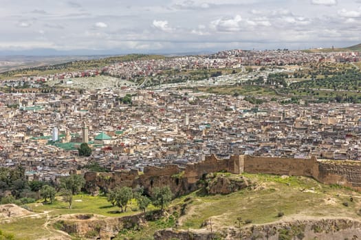 High angle view of the Qarawiyyin Mosque and Al-Qarawiyyin University in the middle of the ancient medina of Fes. Morocco. Horizontally. 