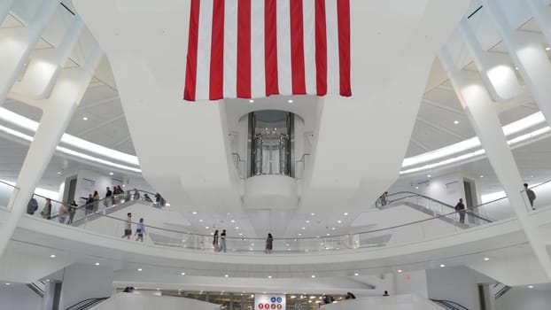 New York City, United States - 10 Sept 2023: World Trade Center Oculus architecture. Manhattan Downtown Financial District, USA. September 11 remembrance, memorial american flag. Patriot day. People.