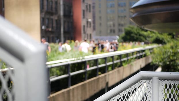 New York City, United States - 1 Sept 2023: High Line elevated greenway, Manhattan Midtown, USA. People walking in park. Promenade in garden greenery. American street life, Chelsea Hudson Yards.