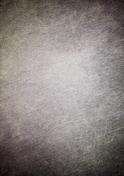 Dark gray textured background sets a dramatic and moody atmosphere, perfect for various design projects