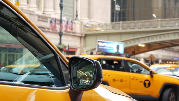 New York City, United States - 4 Sept 2023: Grand Central Terminal railway station, 42 street. Manhattan Midtown. Yellow taxi cab, cars on Pershing Square, USA. American urban road traffic and people.
