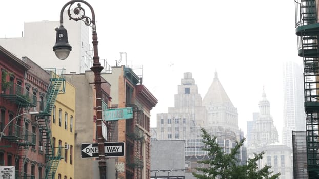 New York City, United States - 8 Sept 2023: Manhattan Soho district Grand and Centre street near Broadway. Urban old classic architecture. Civic Center municipal building, USA Court. Lantern in fog.