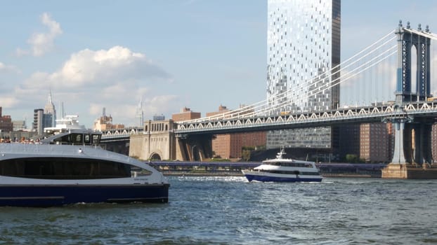 New York City, United States - 12 Sept 2023: Downtown skyline from ferry boat. Manhattan bridge. Skyscraper from ferryboat. East river waterfront panorama, riverfront buildings architecture, USA.