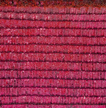 Intricate layers of pink and red create a mesmerizing abstract pattern