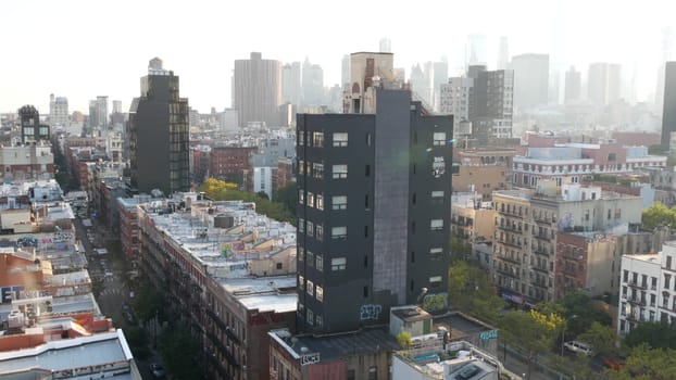 New York City, United States - 7 Sept 2023: Manhattan skyline cityscape. Rooftop graffiti on residential district buildings roofs. NYC Real Estate, urban streets architecture. Lower East Side district