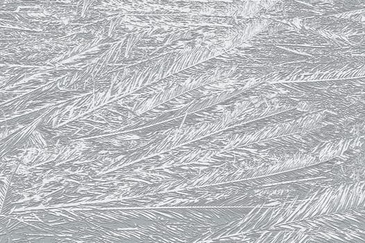 Beautiful ice crystals creating a stunning winter scene on a frozen window pane
