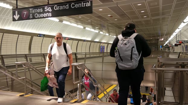 New York City, United States - 1 Sept 2023: Hudson Yards subway station, underground metropolitan platform sign. Metro railway passenger transport. Text signage: Times Square, Grand Central, Queens.