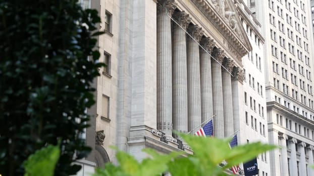 New York City, United States - 3 Sept 2023: Manhattan Downtown Financial District urban architecture. American flag. Wall street Stock Exchange building facade columns, USA Stock Market trading, NYC.