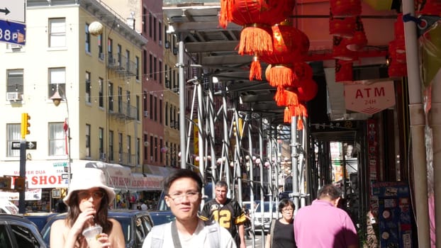 New York City, United States - 14 Sept 2023: Manhattan Chinatown Mott street, chinese ethnic district buildings architecture, USA. Red round paper lanterns, people and hieroglyph signs. Little China.
