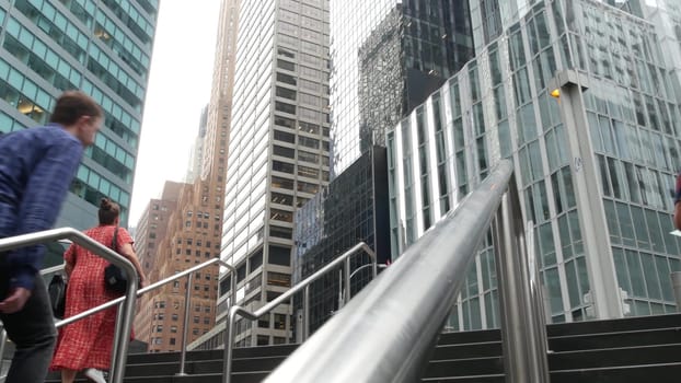 New York City, United States - 11 Sept 2023: Manhattan Midtown office buildings, Lexington avenue, United States. People pedestrian exiting subway metro station, stairs on 53 street, USA urban life.