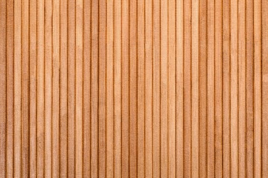 Close-up view of parallel light brown wooden slats creating a warm, textured background
