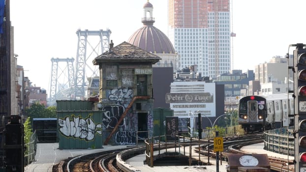 New York City, United States - 7 Sept 2023: Subway station. Metro train, public transportation platform. Elevated outdoor NYC railway Marcy Av, Brooklyn passenger railroad traffic, Williamsburg Bridge