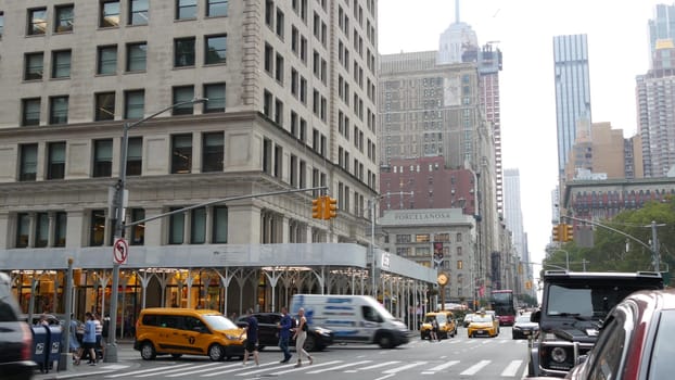 New York City, United States - 8 Sept 2023: Manhattan Midtown Broadway, 23 street, 5 avenue crossroad intersection. Worth Square near Madison Park and Flatiron Building, USA. People. Yellow taxi car
