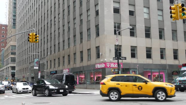 New York City, United States - 9 Sept 2023: Manhattan Downtown Financial District Water street crossroad intersection. USA NY city life. Urban road car traffic. Yellow taxi. People pedestrian