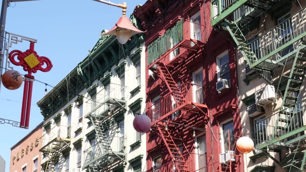 New York City, United States - 14 Sept 2023: Manhattan Chinatown Mott street, chinese ethnic district buildings architecture, USA. American red brick house in little China. Fire escape ladder in NYC.