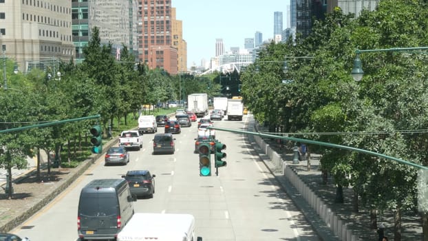New York City, United States - 31 Aug 2023: Manhattan Downtown Financial District street crossroad intersection. Urban road car traffic. People pedestrian. World Trade Center memorial area. Skyline.