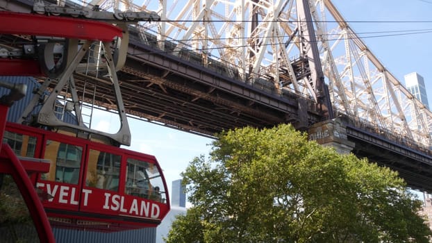 New York City, United States - 12 Sept 2023: Roosevelt Island tramway to Manhattan Midtown. American aerial cable tram near Queensboro Bridge. Urban public transportation, passenger transport in USA.