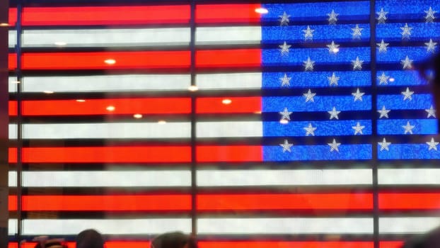 New York City, United States - 5 Sept 2023: Times Square, Manhattan Midtown Broadway street, USA. American flag, NYC urban life. Military island, army recruiting. People pedestrians silhouettes, crowd