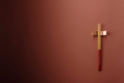 Chopsticks for sushi or other Japanese or Chinese food on a brownstone table. Asian chopsticks