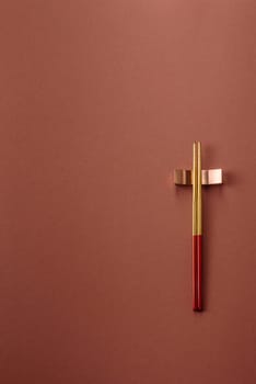 Chopsticks for sushi or other Japanese or Chinese food on a brownstone table. Asian chopsticks