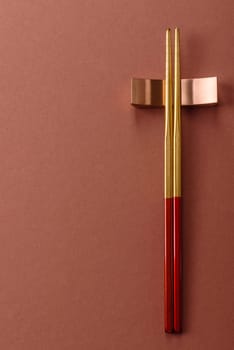 Chopsticks for sushi or other Japanese or Chinese food on a brownstone table. Asian chopsticks