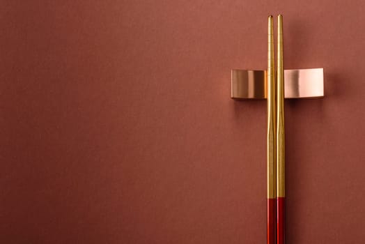 Chopsticks for sushi or other Japanese or Chinese food on a brownstone table. Asian chopsticks