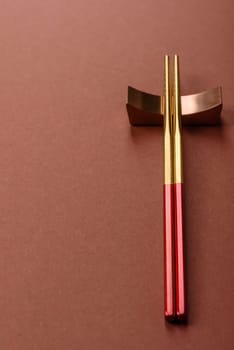 Chopsticks for sushi or other Japanese or Chinese food on a brownstone table. Asian chopsticks