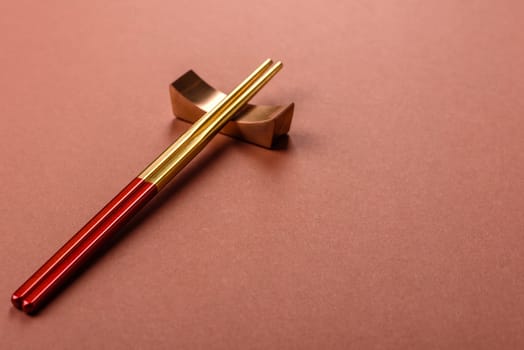 Chopsticks for sushi or other Japanese or Chinese food on a brownstone table. Asian chopsticks
