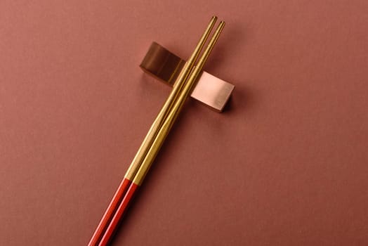 Chopsticks for sushi or other Japanese or Chinese food on a brownstone table. Asian chopsticks