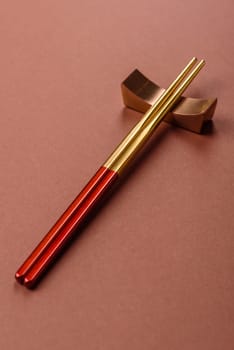 Chopsticks for sushi or other Japanese or Chinese food on a brownstone table. Asian chopsticks