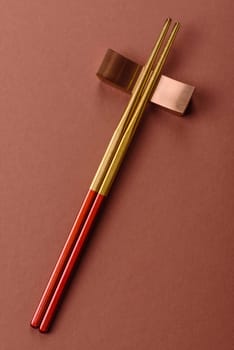 Chopsticks for sushi or other Japanese or Chinese food on a brownstone table. Asian chopsticks