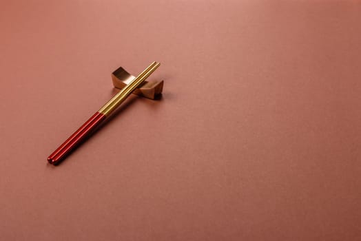 Chopsticks for sushi or other Japanese or Chinese food on a brownstone table. Asian chopsticks